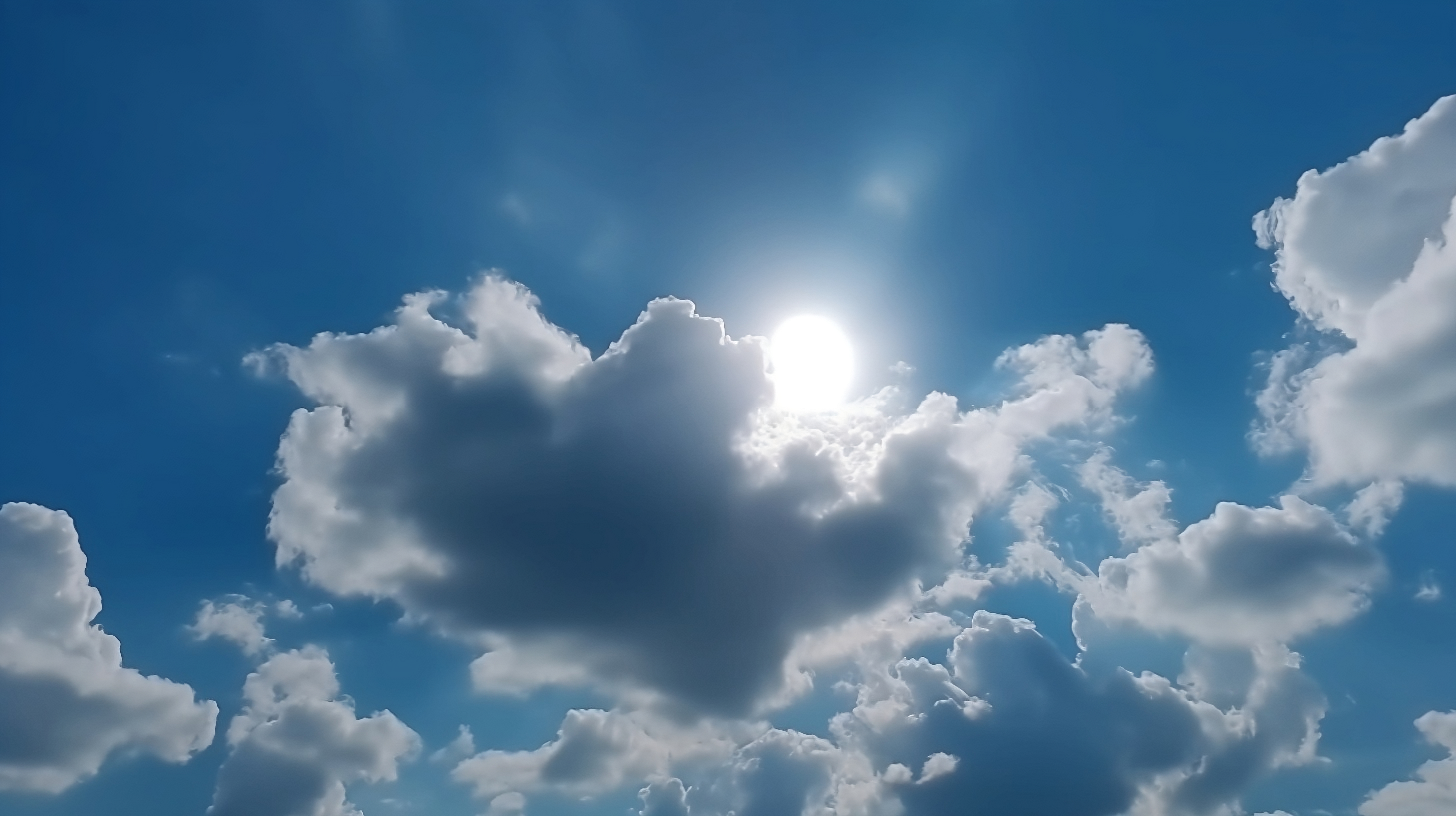 Beautiful Sun Shining Through Soft Clouds in Sky