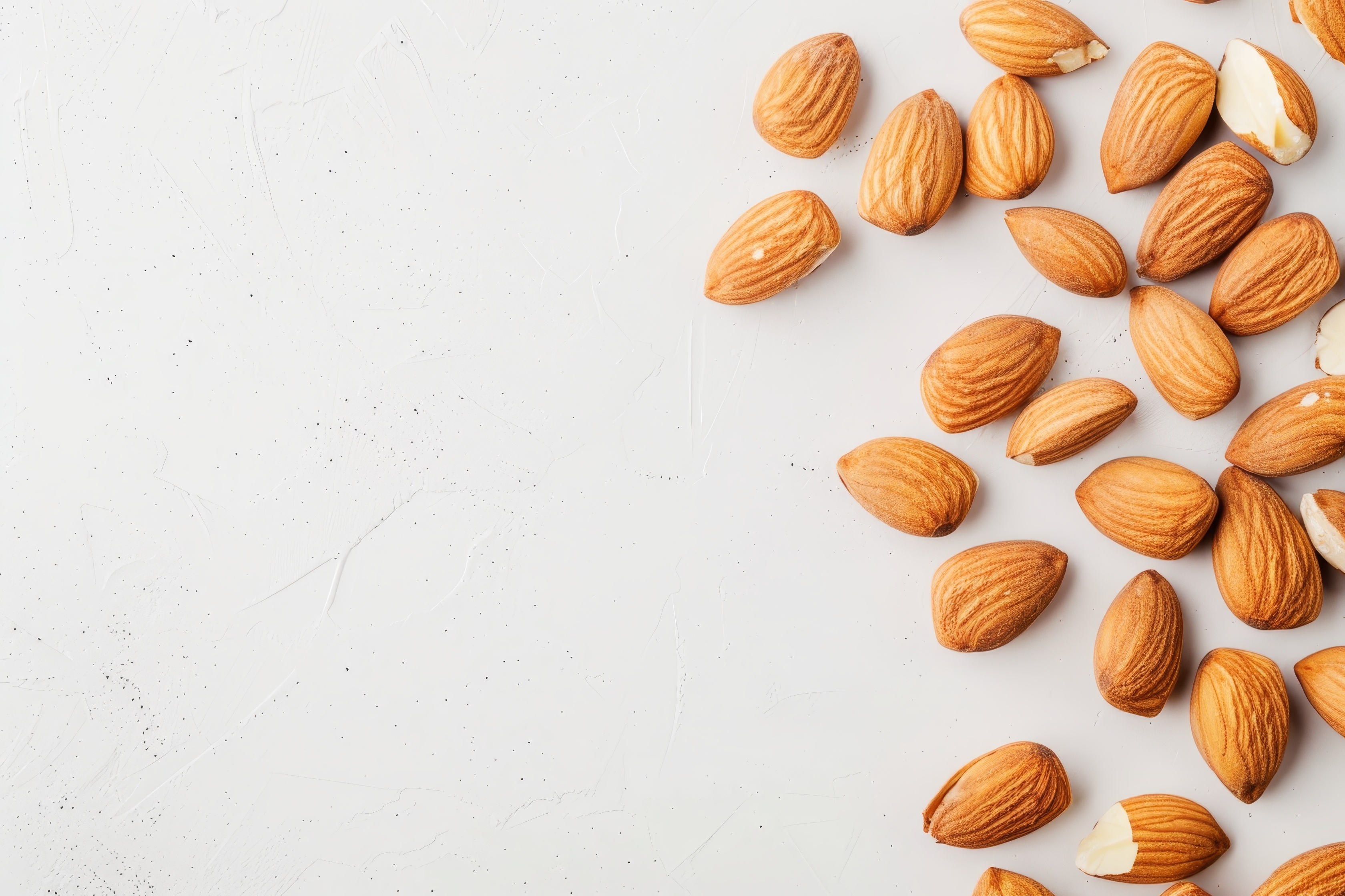 Almonds isolated on light background. Almonds top view