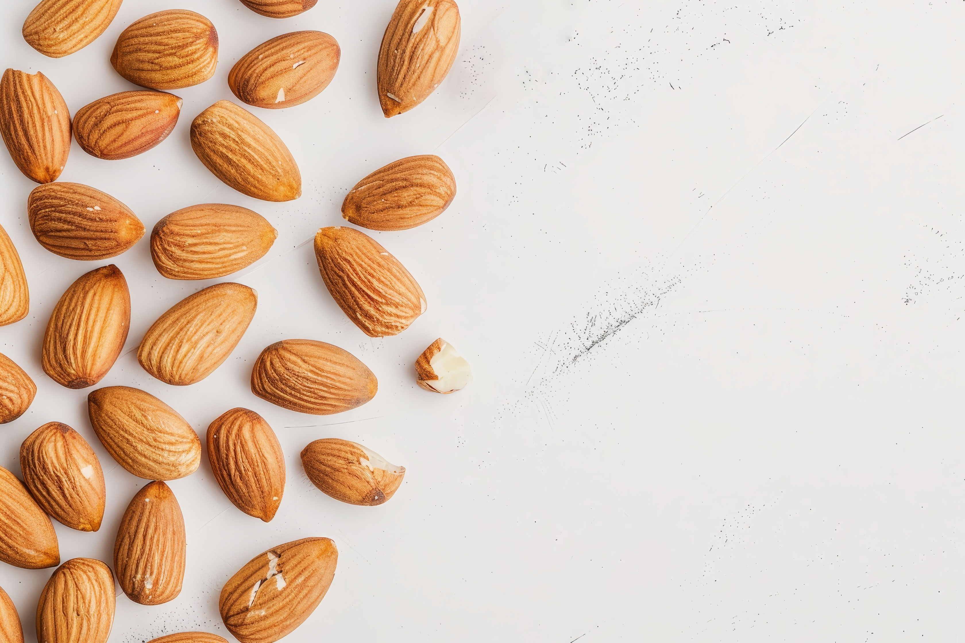 Almonds isolated on light background. Almonds top view