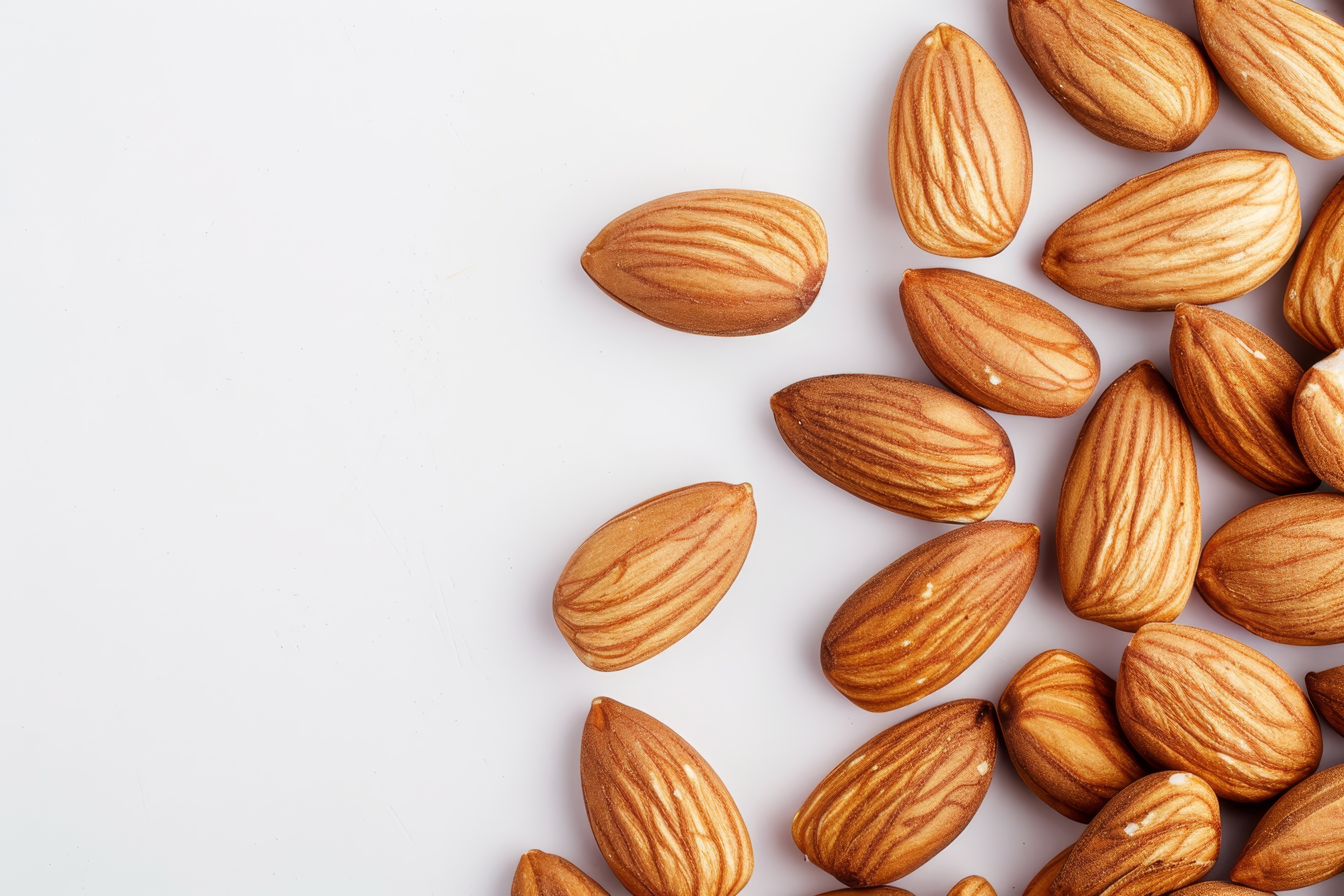 Almonds isolated on light background. Almonds top view