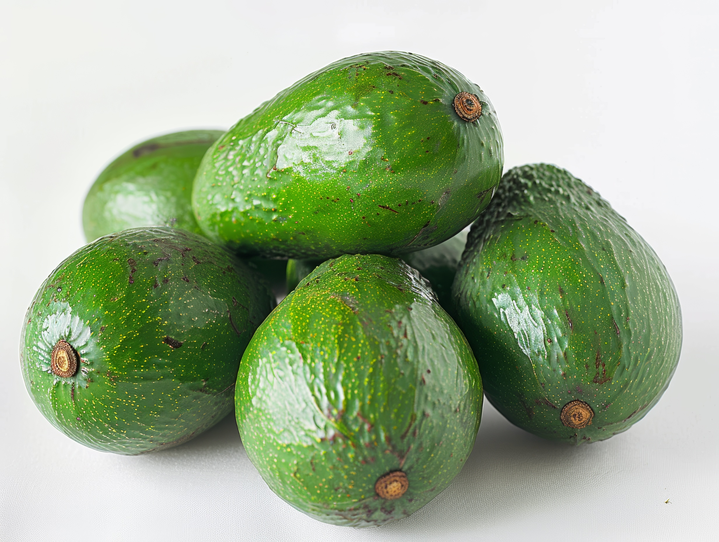 Green and fresh Avocados on white background