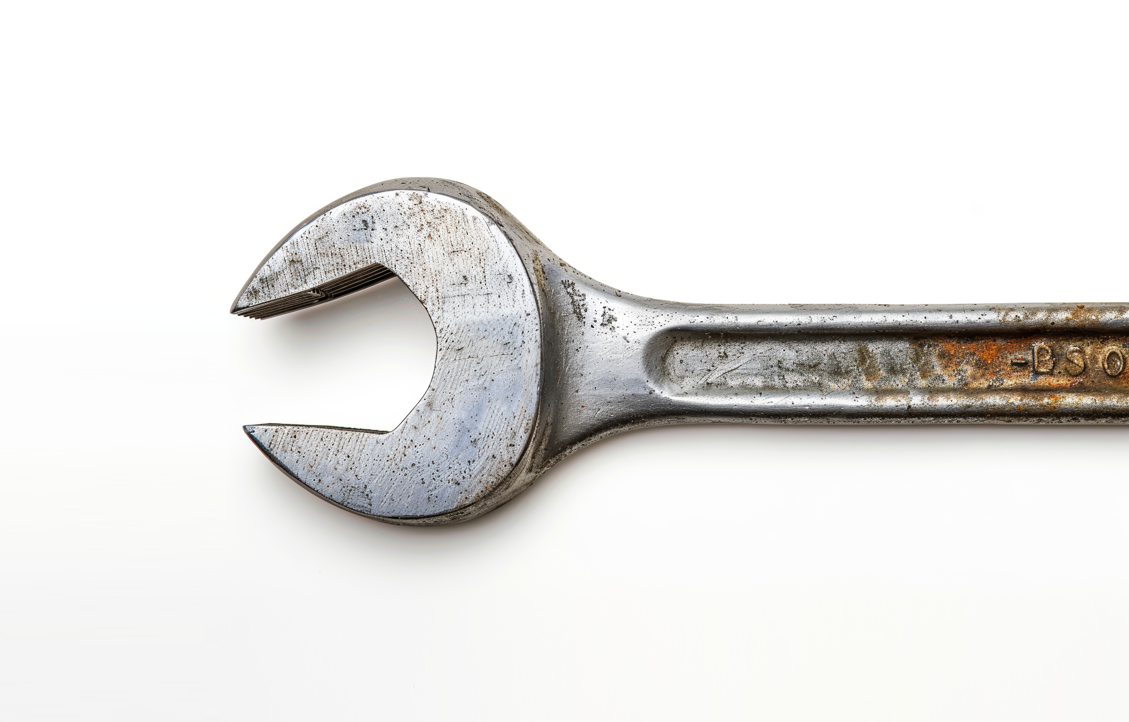 Old rusty wrench on white background