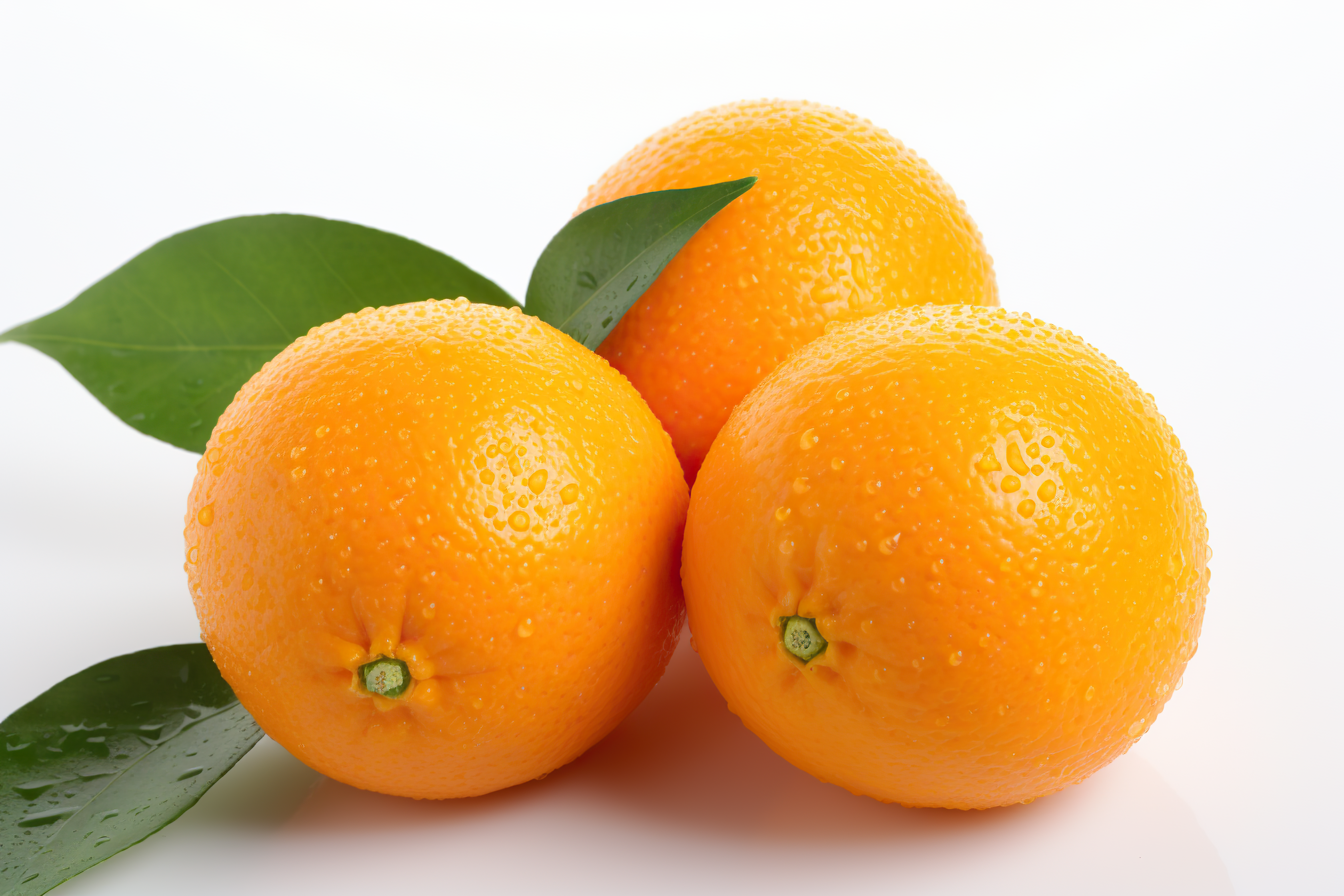 Orange fruit with leaves isolated on white background