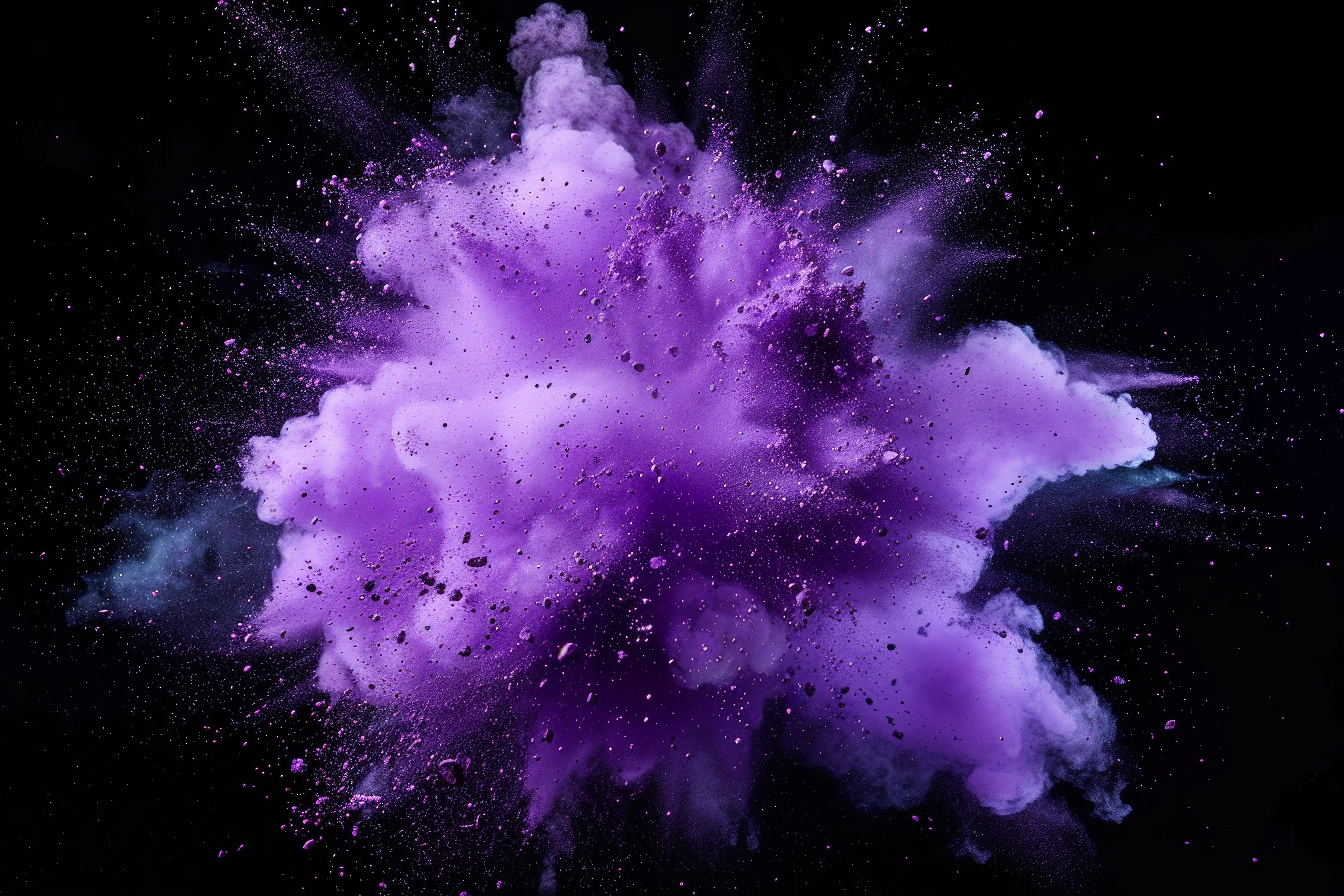 Purple powder explosion on black background