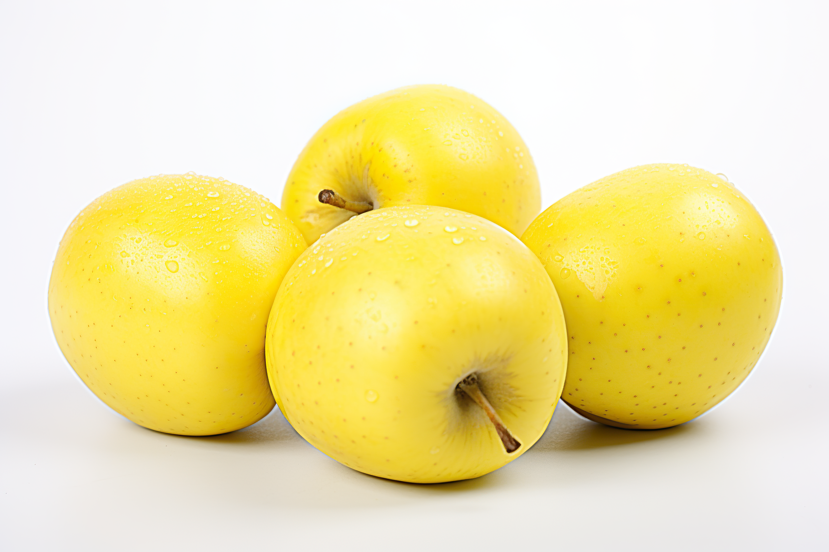 Ripe yellow apple isolated on white background