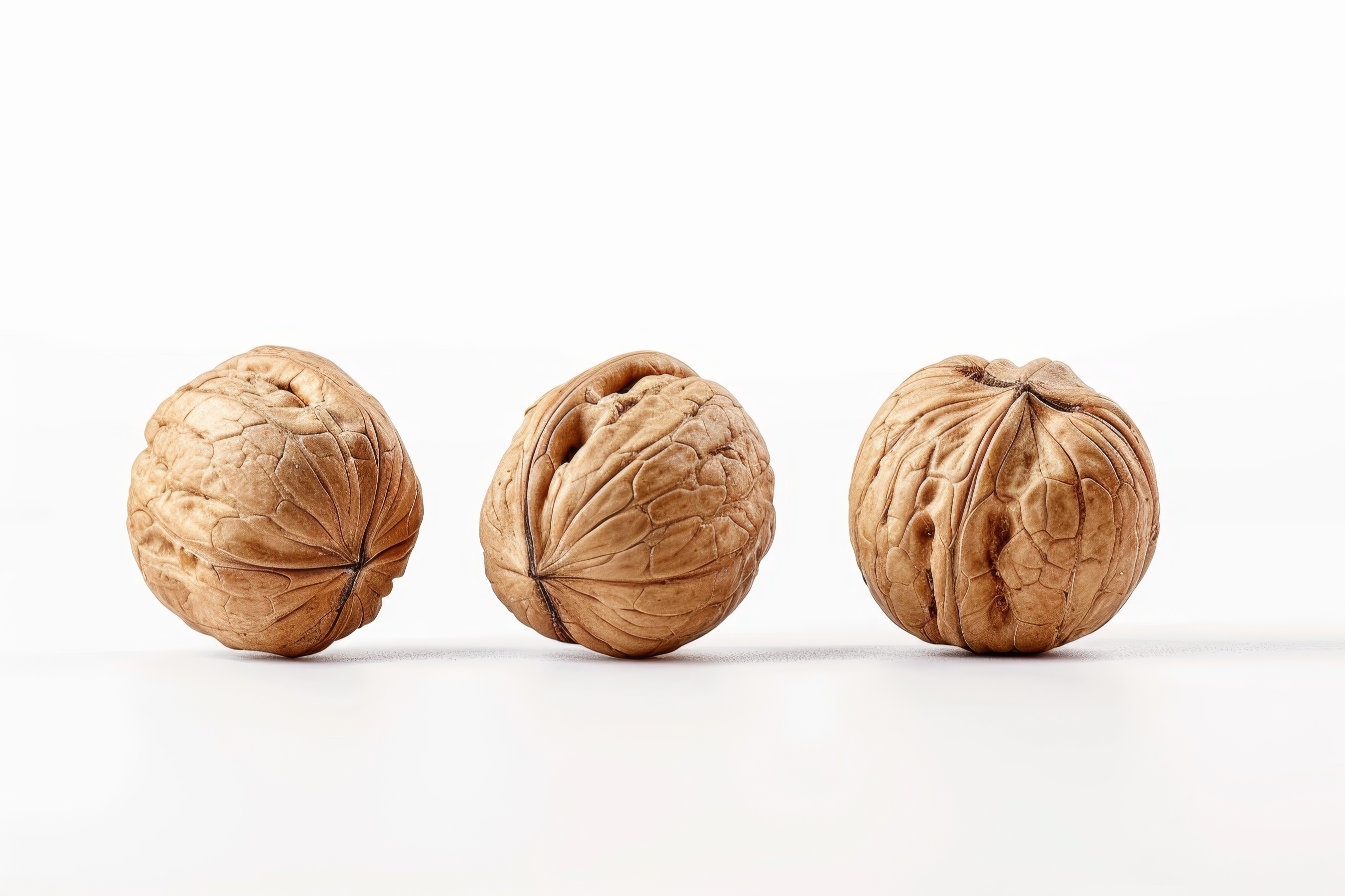 Three walnuts isolated on white background
