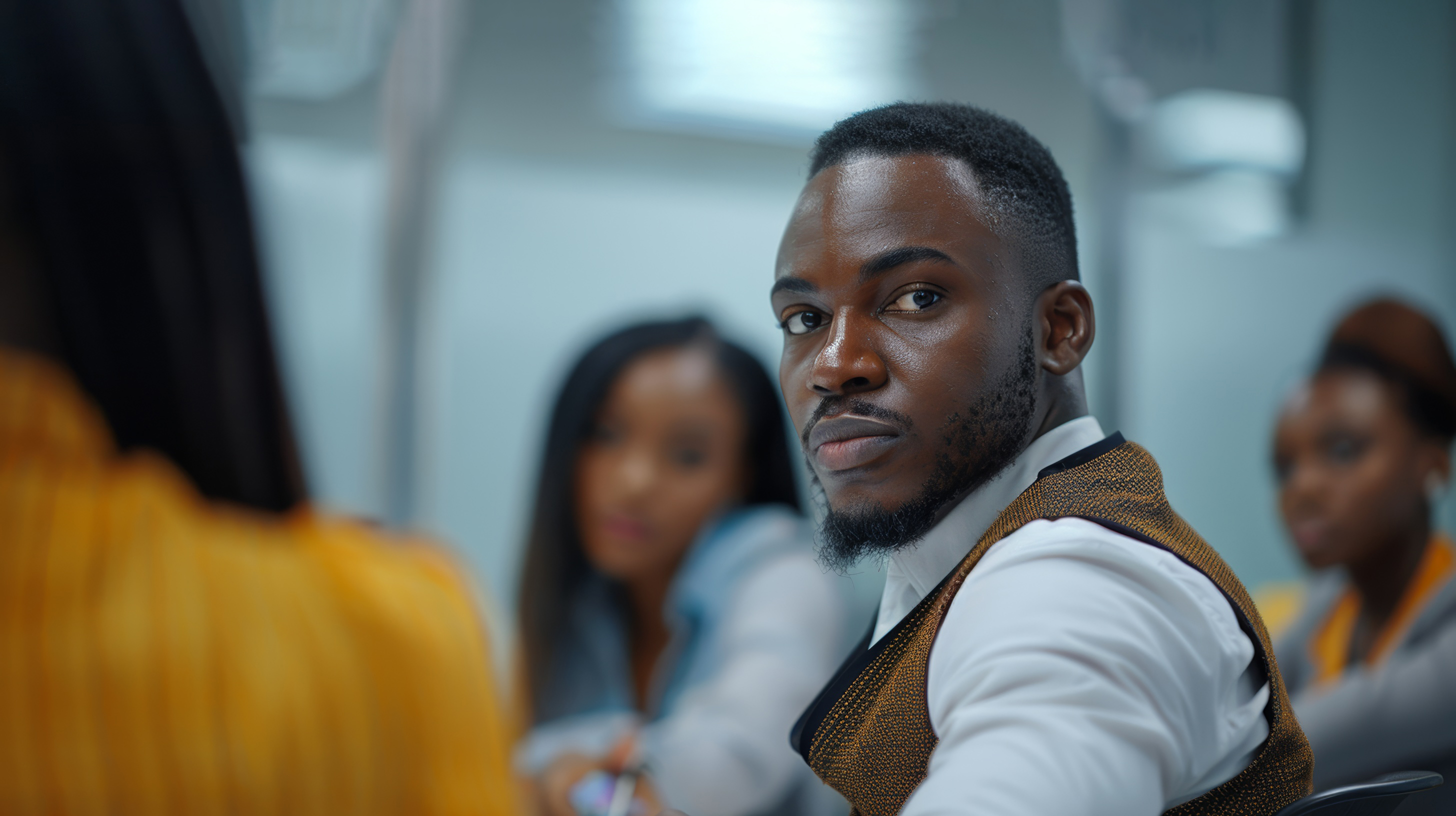 Young African businessman talking with a group of coworkers during a meeting together, Generative AI